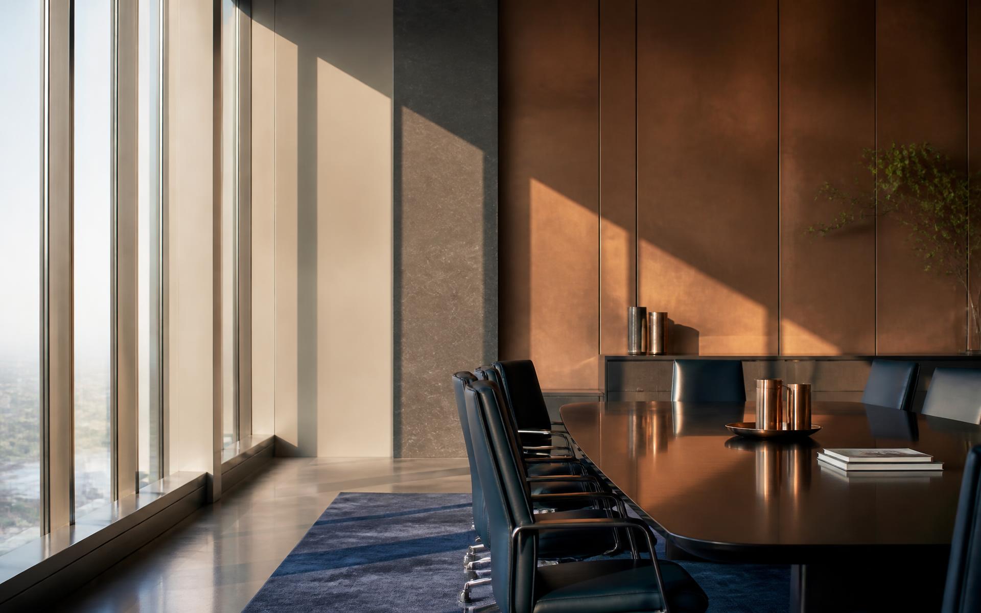 Executive boardroom with architectural light and copper detailing